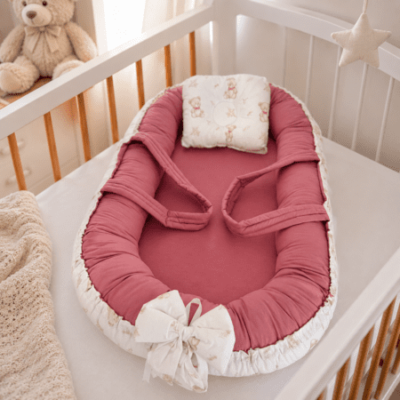 Cale bébé cocon rose avec coussin naissance et réducteur intégré