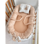 Cale bébé cocon rose avec coussin naissance et réducteur intégré